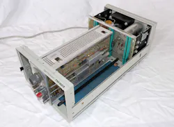 9. Taking the cover off the TM503 mainframe lets you service the modules, but it also exposes lethal voltages in the ac power supply at the rear. 9. Taking the cover off the TM503 mainframe lets you service the modules, but it also exposes lethal voltages in the ac power supply at the rear.