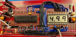 3. PCB showing a voltage measurement of 4.99 V. 3. PCB showing a voltage measurement of 4.99 V.