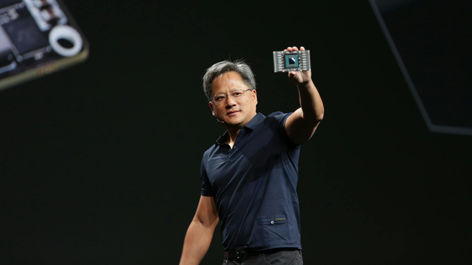 CEO Jensen Huang holding a GPU based on NVIDIA&rsquo;s Pascal architecture.