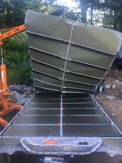 View of Burnie pack, from the rear, with the battery compartment lid peeled off View of Burnie pack, from the rear, with the battery compartment lid peeled off