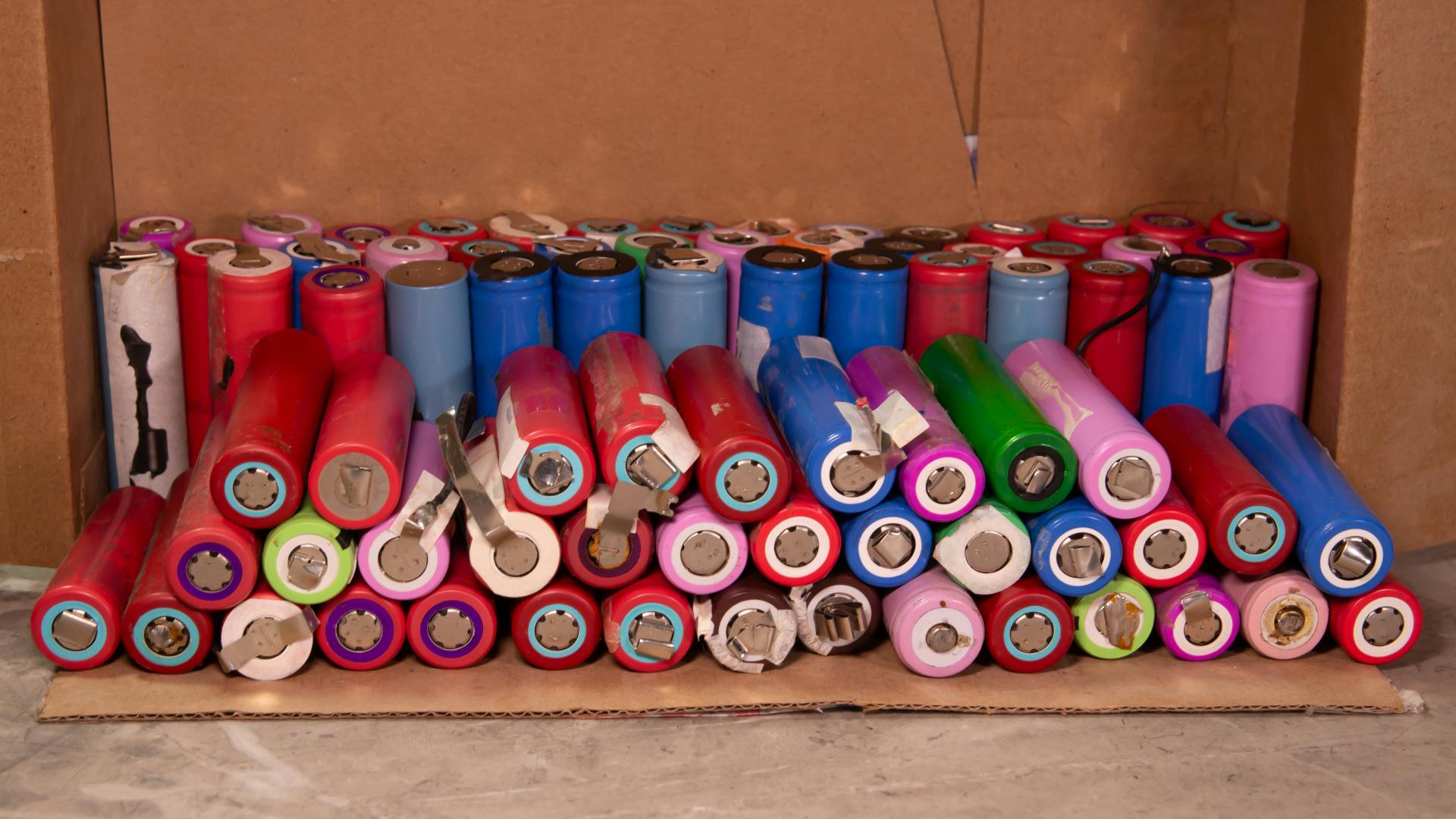 This is a collection of 18650 lithium-ion battery cells, stored very improperly. This is a disaster waiting to happen.