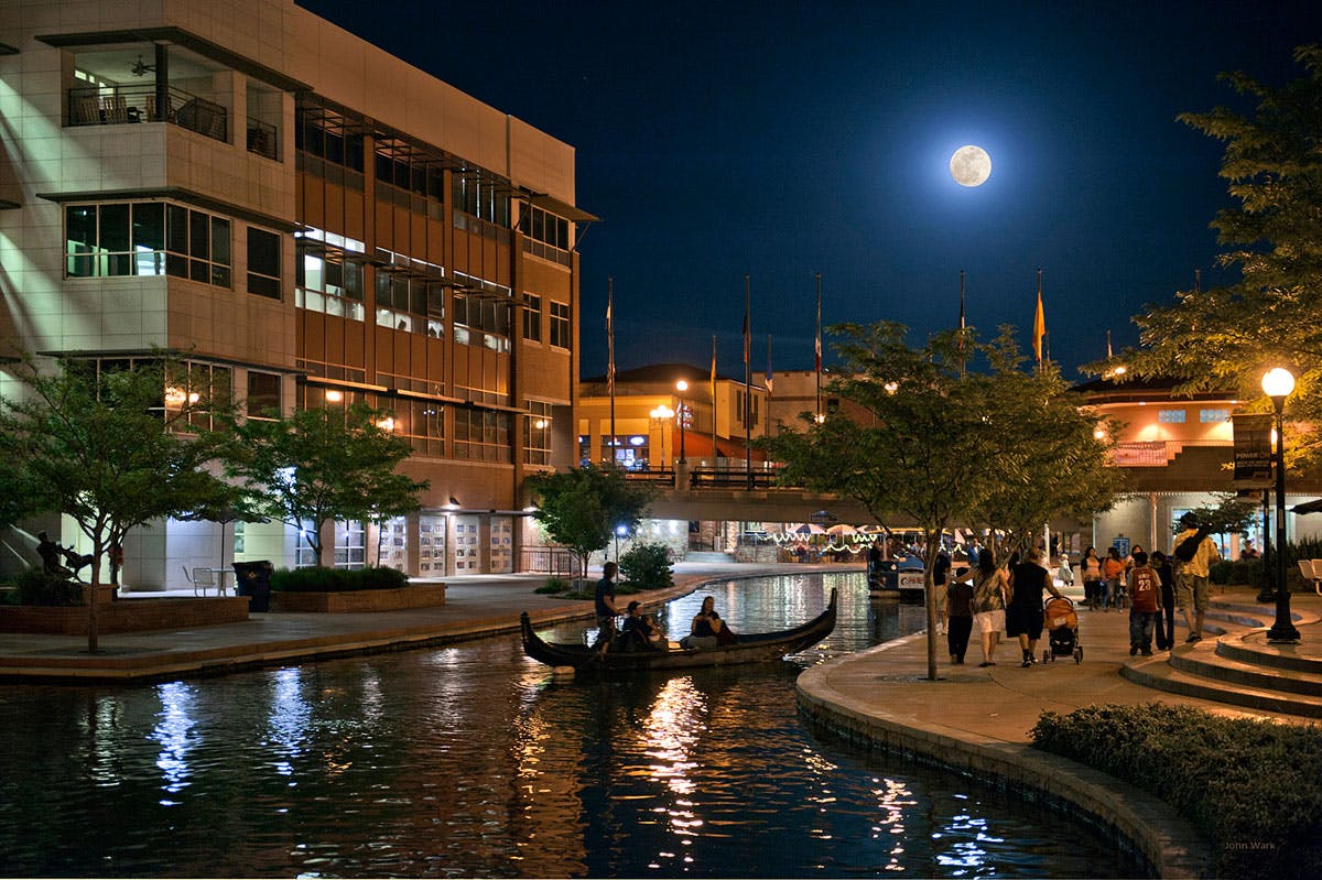 City of Pueblo's Arkansas Riverwalk at night. Image credit John Wark, own work, courtesy Wikimedia Commons.