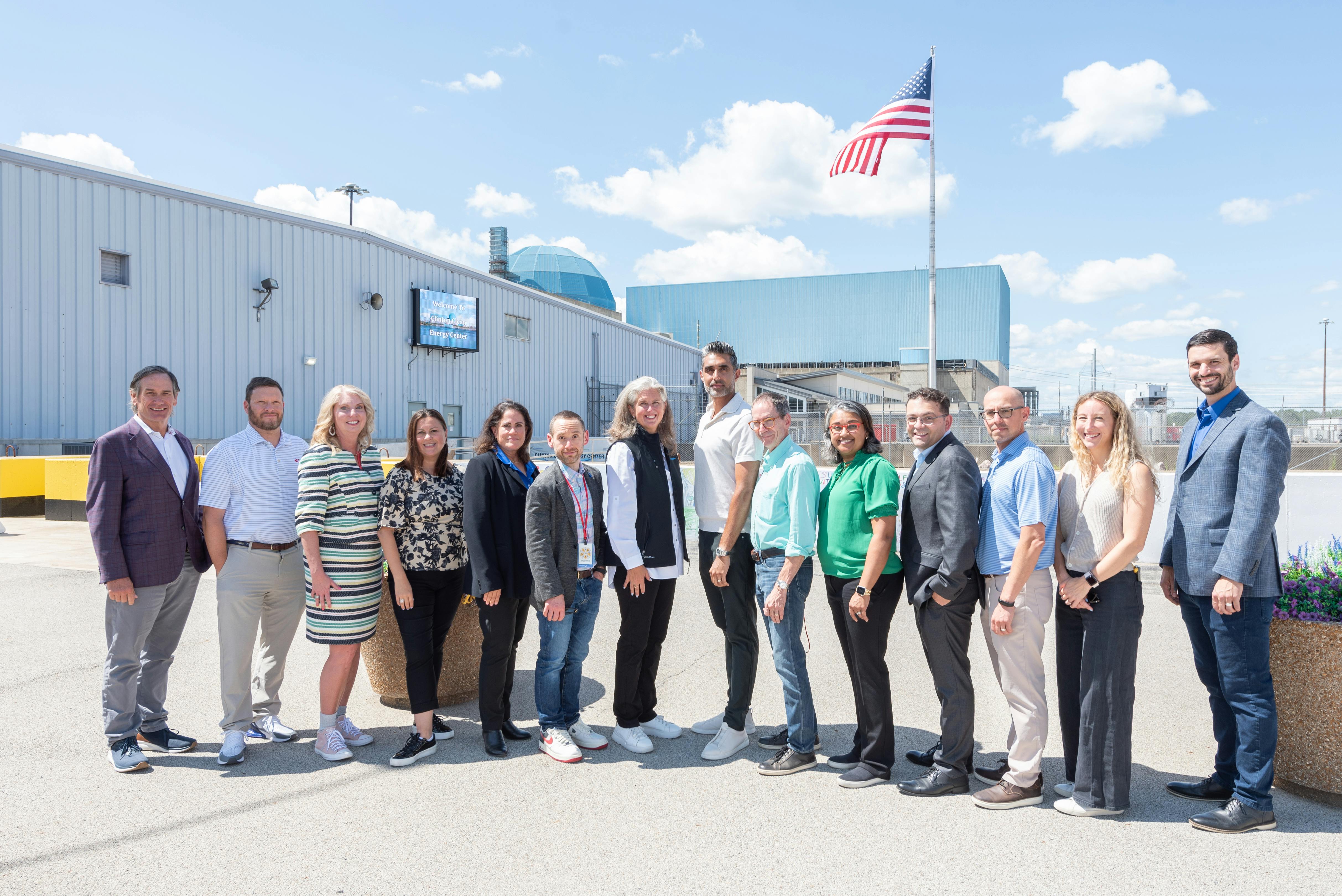 68b1ea50a085a2e65f8cf3dc Group Photo Outside Clinton