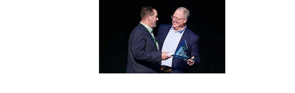 Crum Electric CEO Jeff Hockin, Electrical-U.S. Division board member and AD LLC Board lead director (left), receives the Member of the Year for Leadership Award from AD Electrical & Industrial Business Unit President, Jack Templin (right).