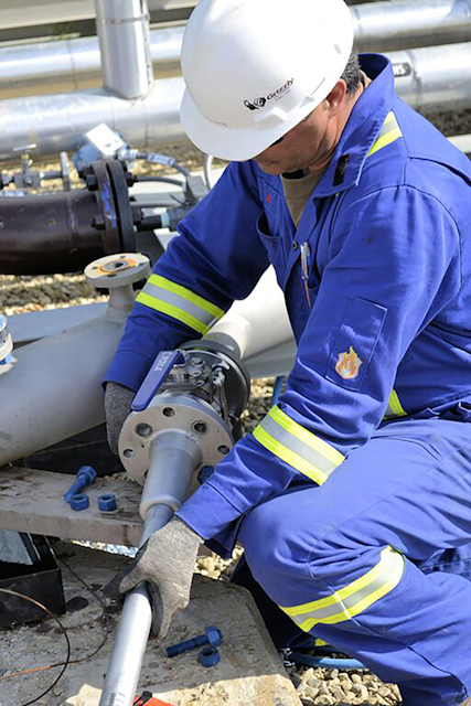A quality engineer installs a new flare meter.