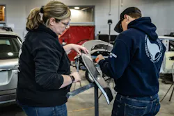 Danica Wooster working with MCST student Bryson Mattox plastic welding a wheel flare. Danica Wooster working with MCST student Bryson Mattox plastic welding a wheel flare.