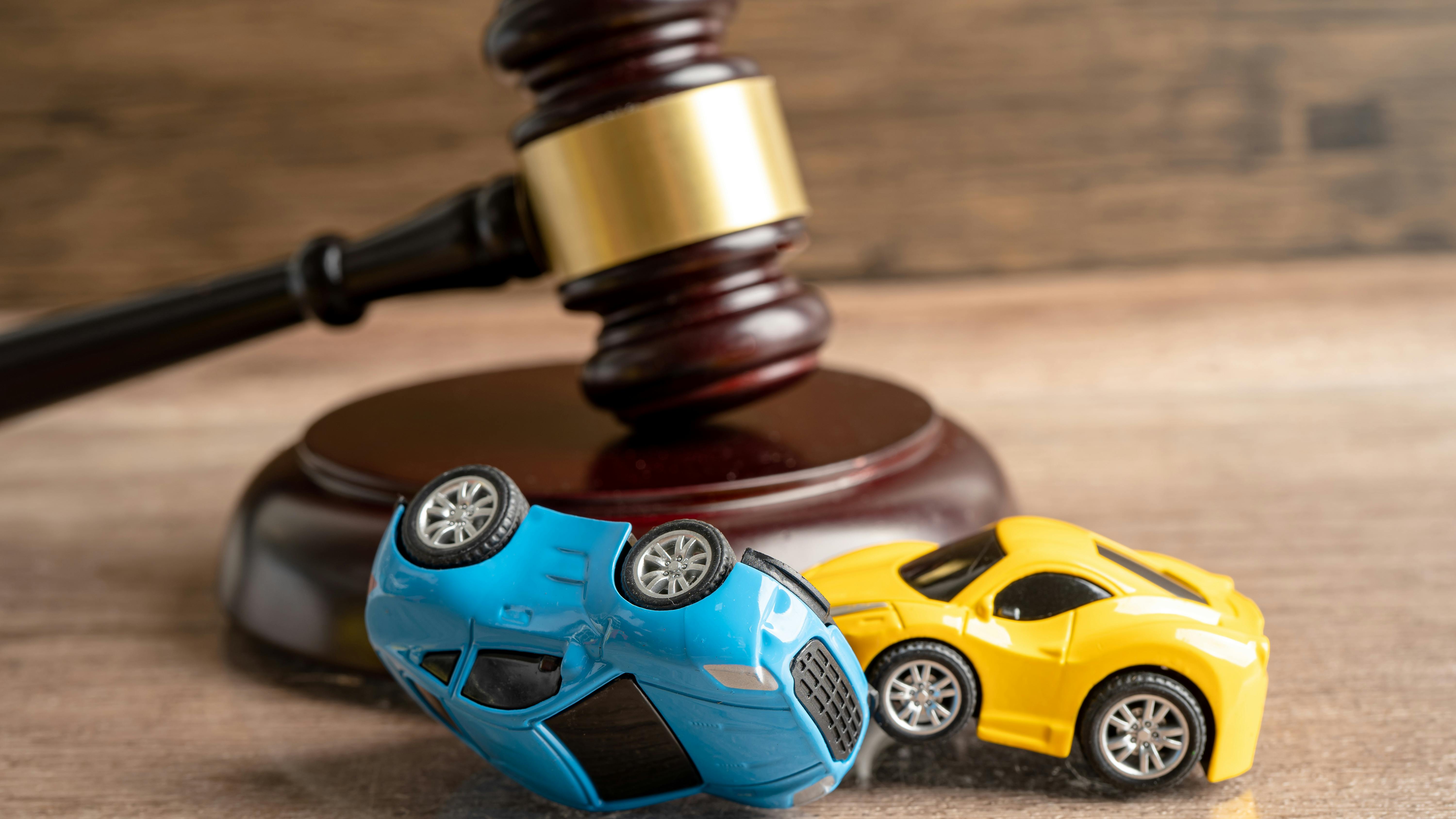 Hammer gavel judge with car vehicle accident