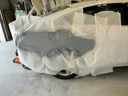 Primer surfacer applied over a larger area to cover multiple dents that were repaired. Primer surfacer applied over a larger area to cover multiple dents that were repaired.