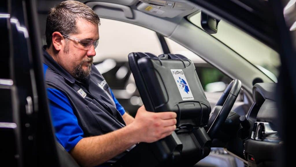 AIrPro Diagnostics Technician in-car