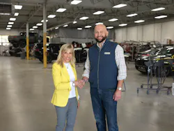 Jerod Guerin, CEO of QCG, shakes hands with Joanne LaMettry. Jerod Guerin, CEO of QCG, shakes hands with Joanne LaMettry.