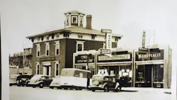 Towers Motor Parts, pictured in this circa 1933 photo taken on Main St. in Nashua, New Hampshire, was one of the earliest auto parts jobbers to also carry paint and body supplies. Note the Nash dealer two doors down. The large building to the left with the cupola would soon be razed to make way for Nashua’s new City Hall. Towers Motor Parts, pictured in this circa 1933 photo taken on Main St. in Nashua, New Hampshire, was one of the earliest auto parts jobbers to also carry paint and body supplies. Note the Nash dealer two doors down. The large building to the left with the cupola would soon be razed to make way for Nashua’s new City Hall.