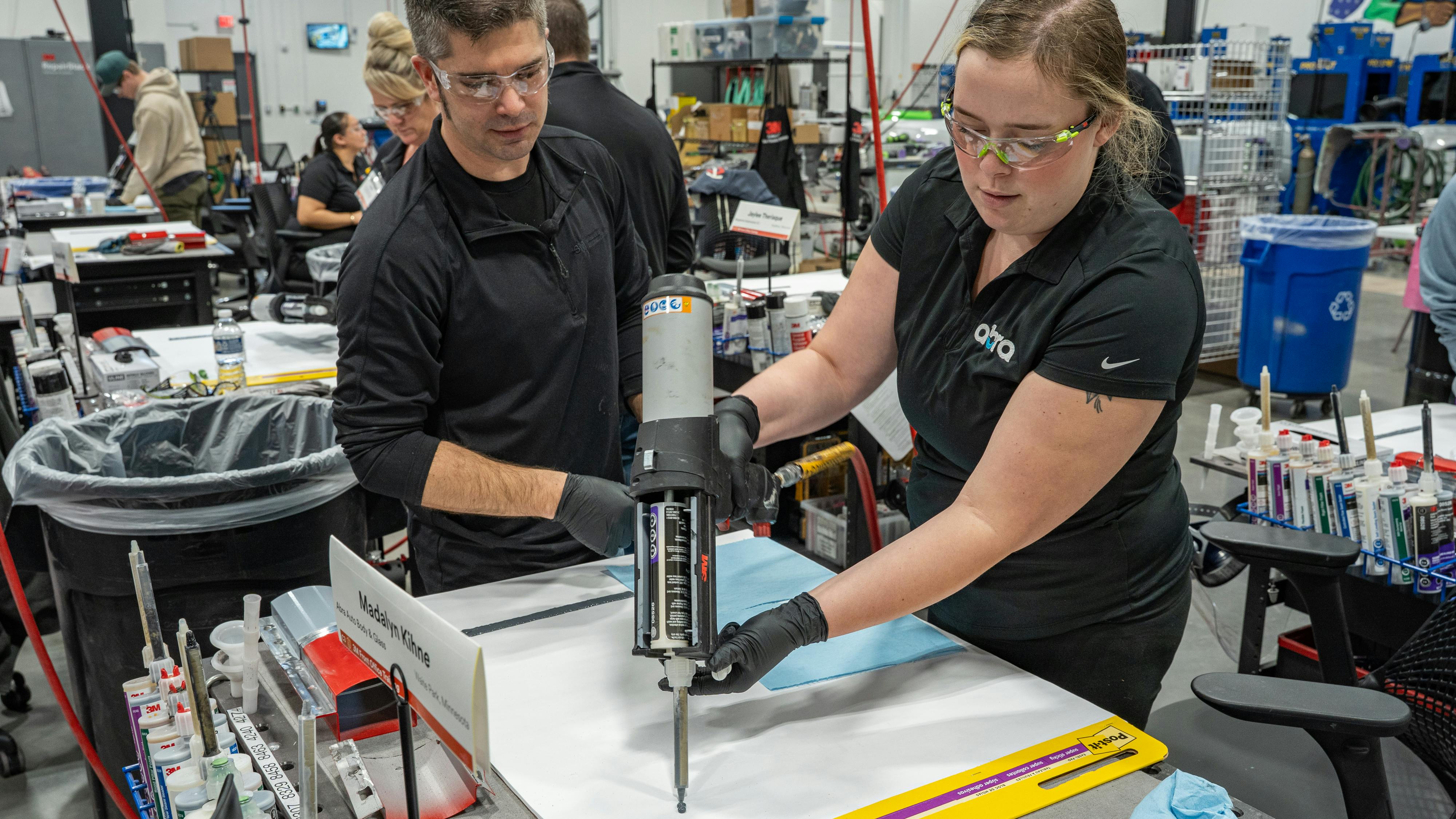 3M Application Engineer Specialist Ryan Marrinan observes a student applying a seam sealer bead at 3M's Skills Development Center. The Front Office Collision Repair Training Course begins next month.