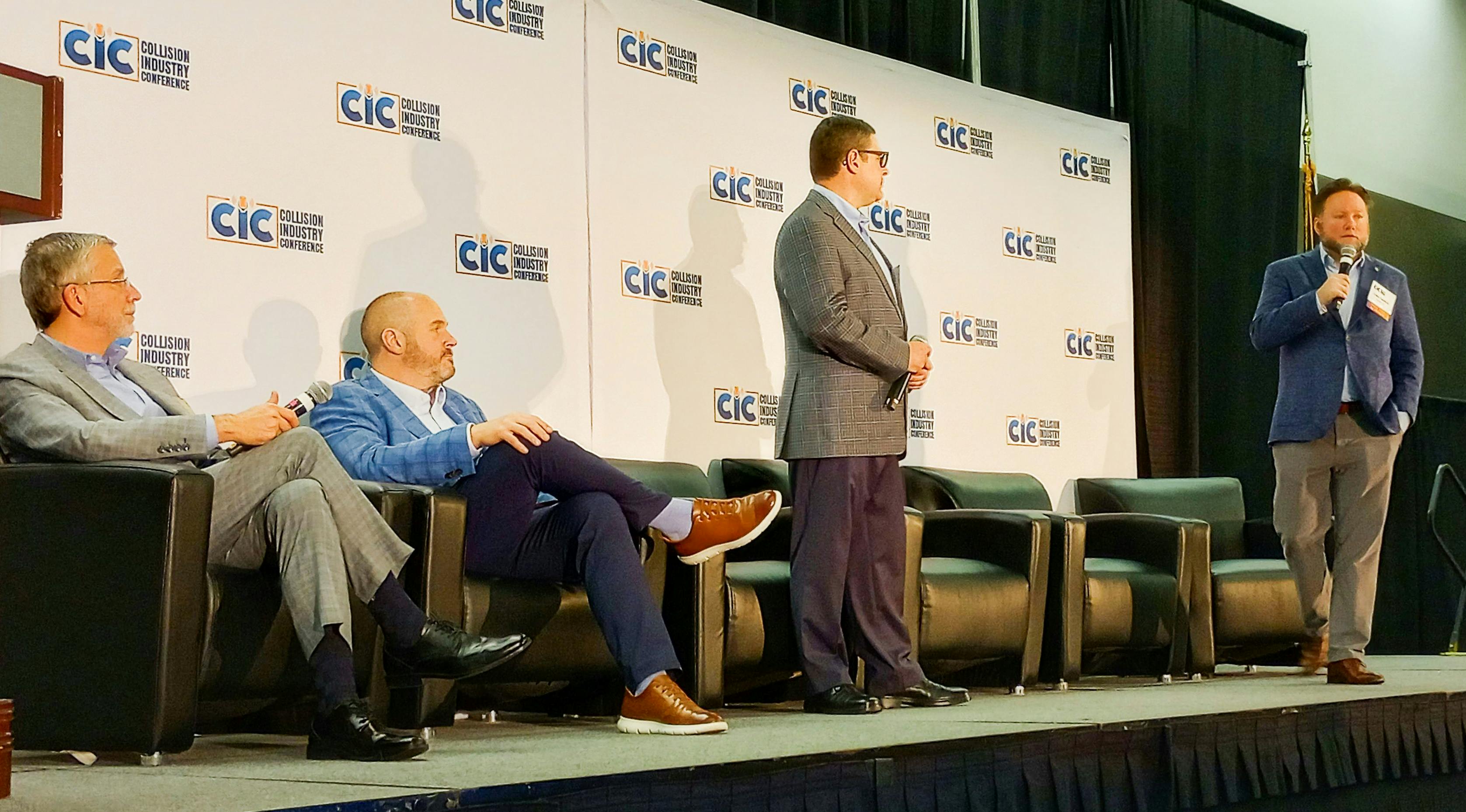 From left, Trent Tinsley, Entegral, and Brian Burbridge, Caliber Collision, listen to StoredTech's Allan Polak and Aleks Pavlinik present a simulated phishing attack.