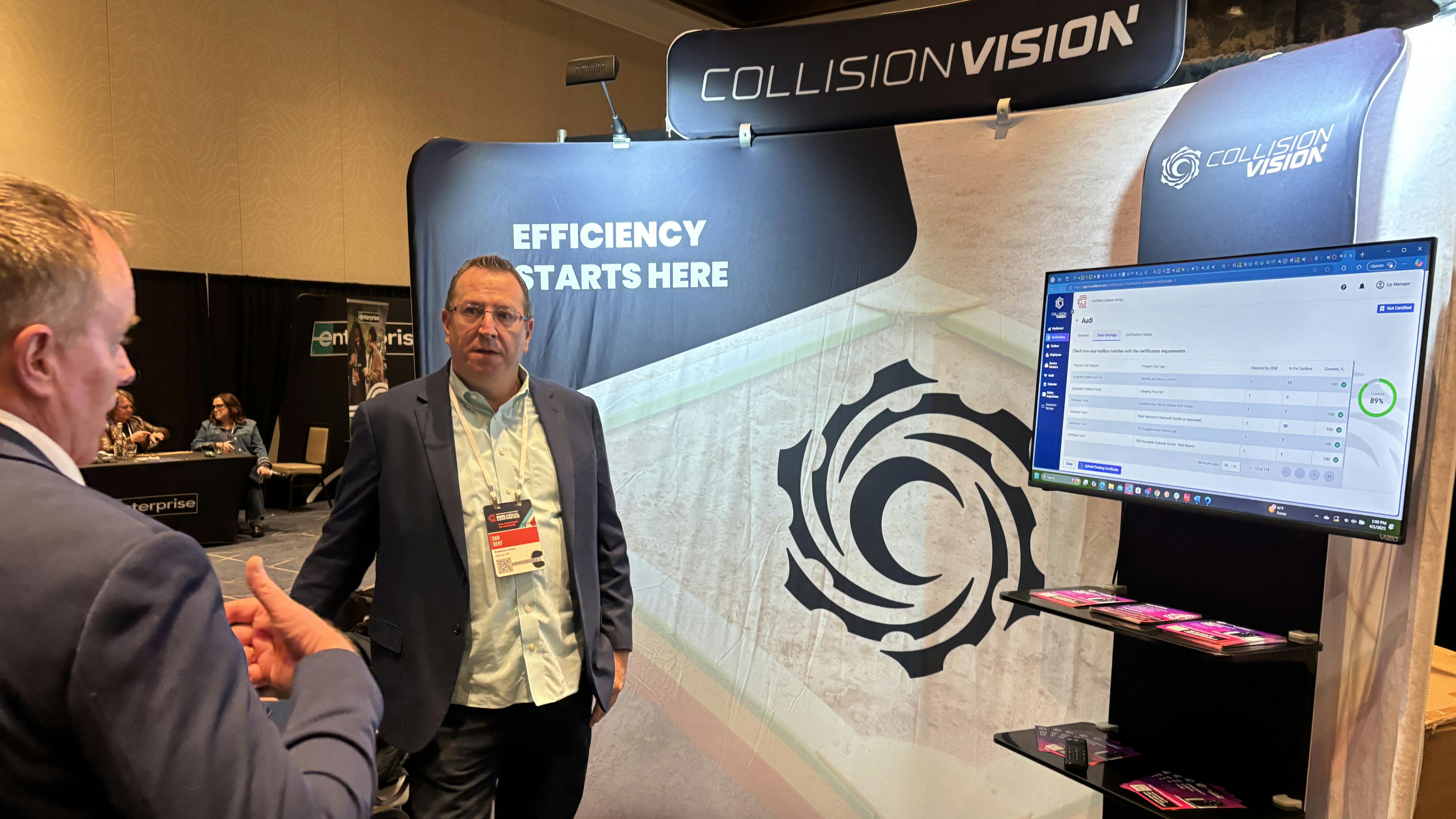 BUILT FOR EFFICIENCY: Dan Dent (right) demonstrates the platform to Les Pawlowski, general manager of Symach, at the recent Certified Collision Group Conference in Nashville, Tennessee.