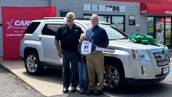 Michael Esler receives a 2012 GMC Terrain from the NABC Recycled Rides Program.