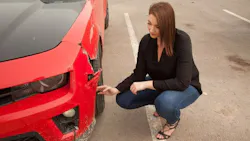 The author, pictured here with a collision-damaged Camaro. The author, pictured here with a collision-damaged Camaro.