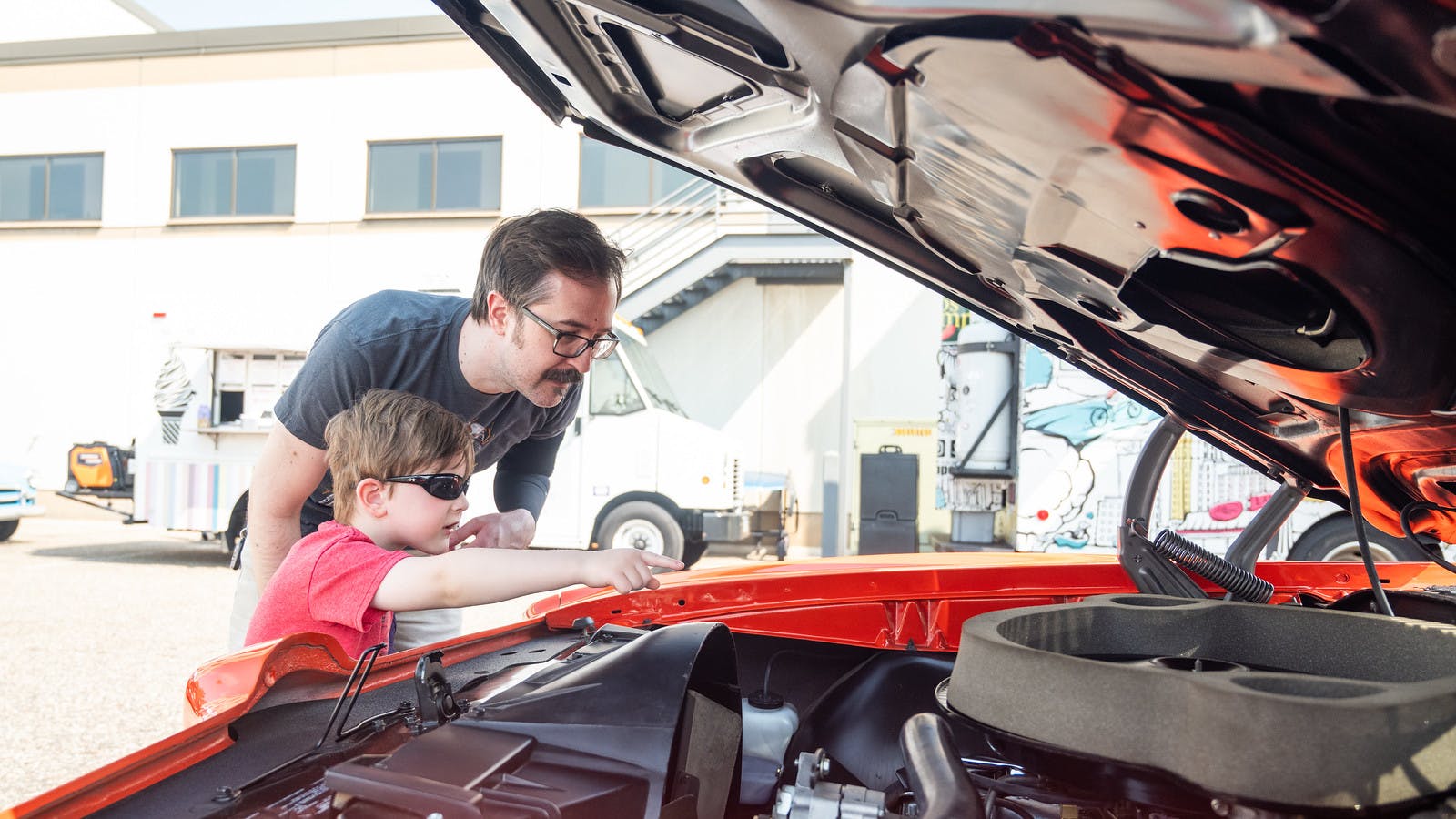 Sean and Bjorn Anton check out the interior of a car during the show.