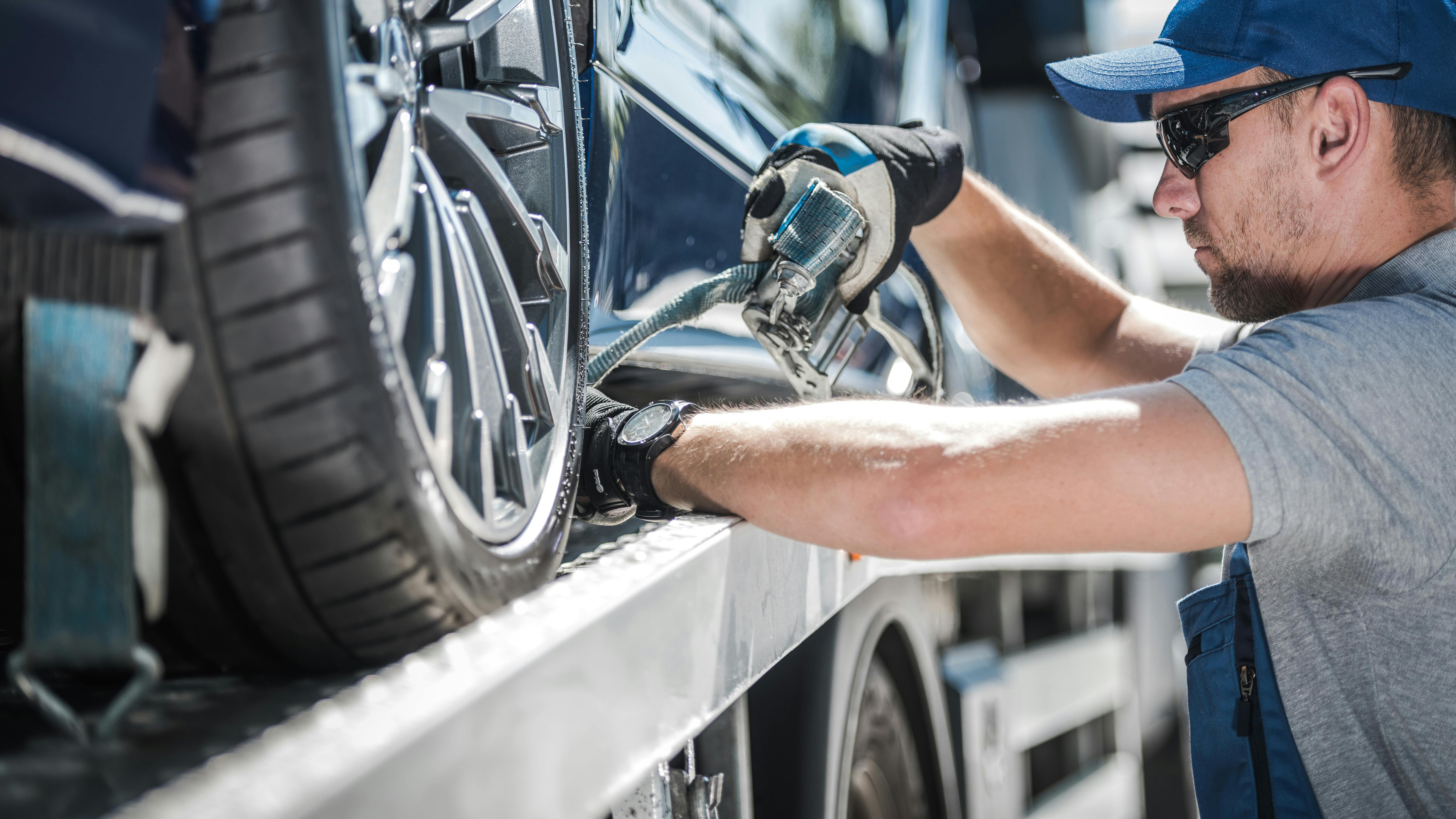 Car on flatbed tow truck