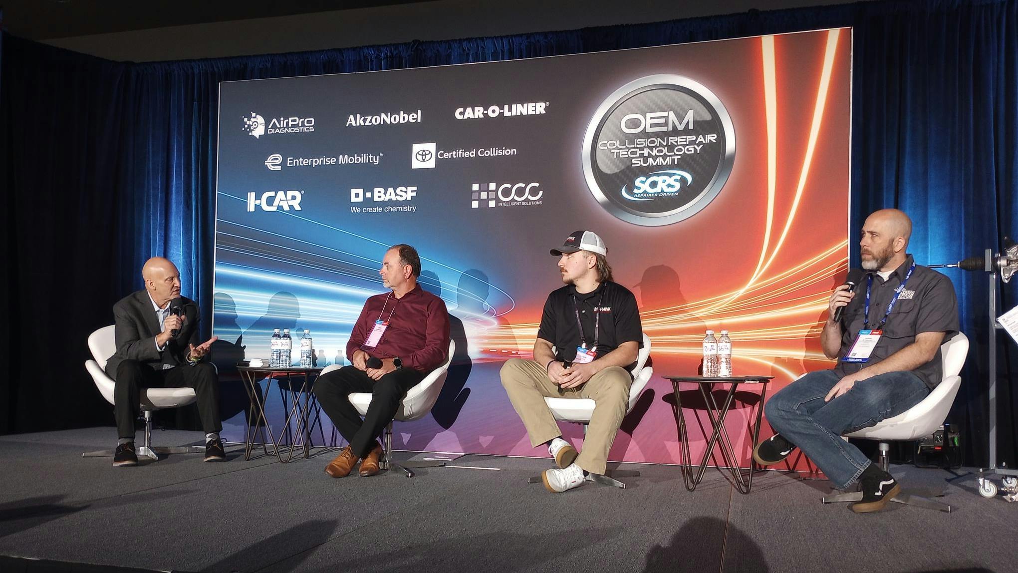 Mike Anderson of CollisionAdvice.com, left, leads a panel discussion about steering gear and column safety inspections with Gerry Rosenbarker and Tyler Foote of Mohawk Collision Center and Andrew Batenhorst of Pacific BMW Collision Center at the OEM Collision Repair Technology Summit during the SEMA Show.