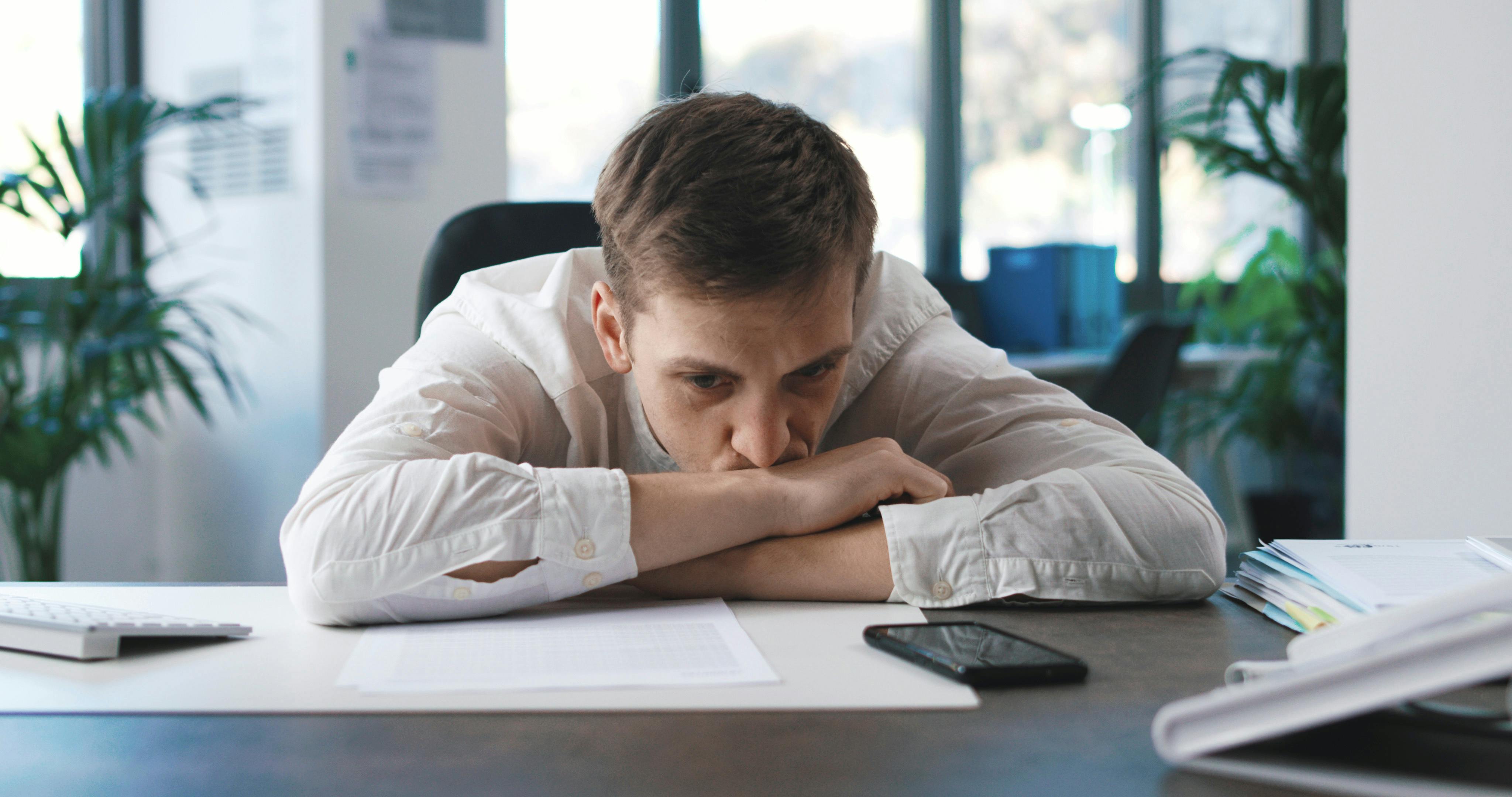Pensive employee at desk