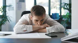Pensive employee at desk Pensive employee at desk