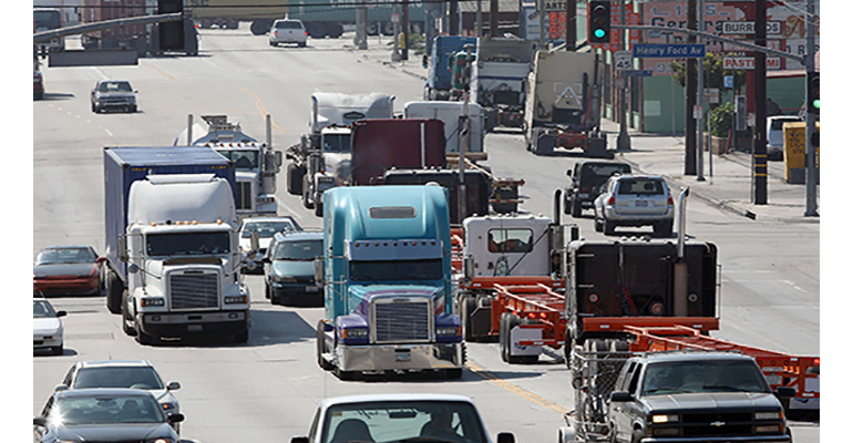 Refrigeratedtransporter 3649 Trucks In Heavy Traffic Getty David Mcnew 0