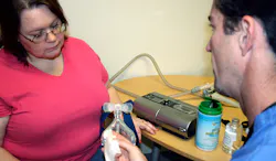 A FusionHealth physician works with a truck driver in the sleep disorder breathing program Mobile teams of FusionHealth doctors test drivers where they sleep and the company gathers data from positive airway pressure PAP devices that drivers use to continually monitor care and adjust if necessary Photo courtesy FusionHealth A FusionHealth physician works with a truck driver in the sleep disorder breathing program Mobile teams of FusionHealth doctors test drivers where they sleep and the company gathers data from positive airway pressure PAP devices that drivers use to continually monitor care and adjust if necessary Photo courtesy FusionHealth