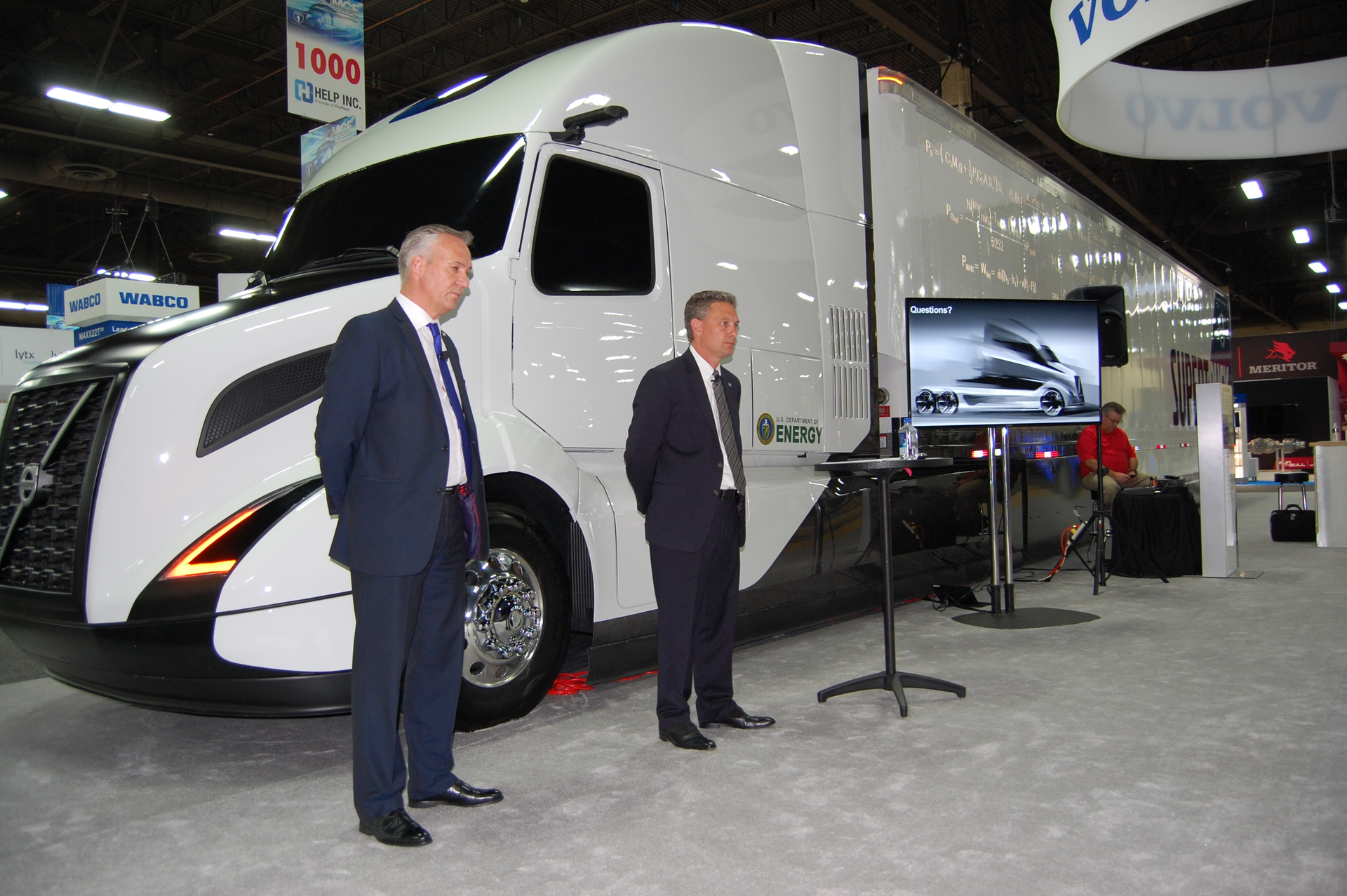 VTNA39s Nyberg at left and Long right made their presentations while in front of Volvo39s Super Truck concept vehicle Photo by Sean KilcarrFleet Owner