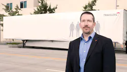 Scott Cornell a transportation crime and theft specialist at the Travelers Companies stands near the disguised Travelers Sting Trailer Scott Cornell a transportation crime and theft specialist at the Travelers Companies stands near the disguised Travelers Sting Trailer