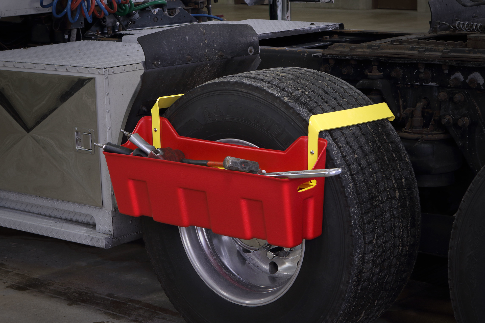 Minimizer39sTool Caddy attaches to the tire creating a space to store up to 100 lbs of tools and gear
