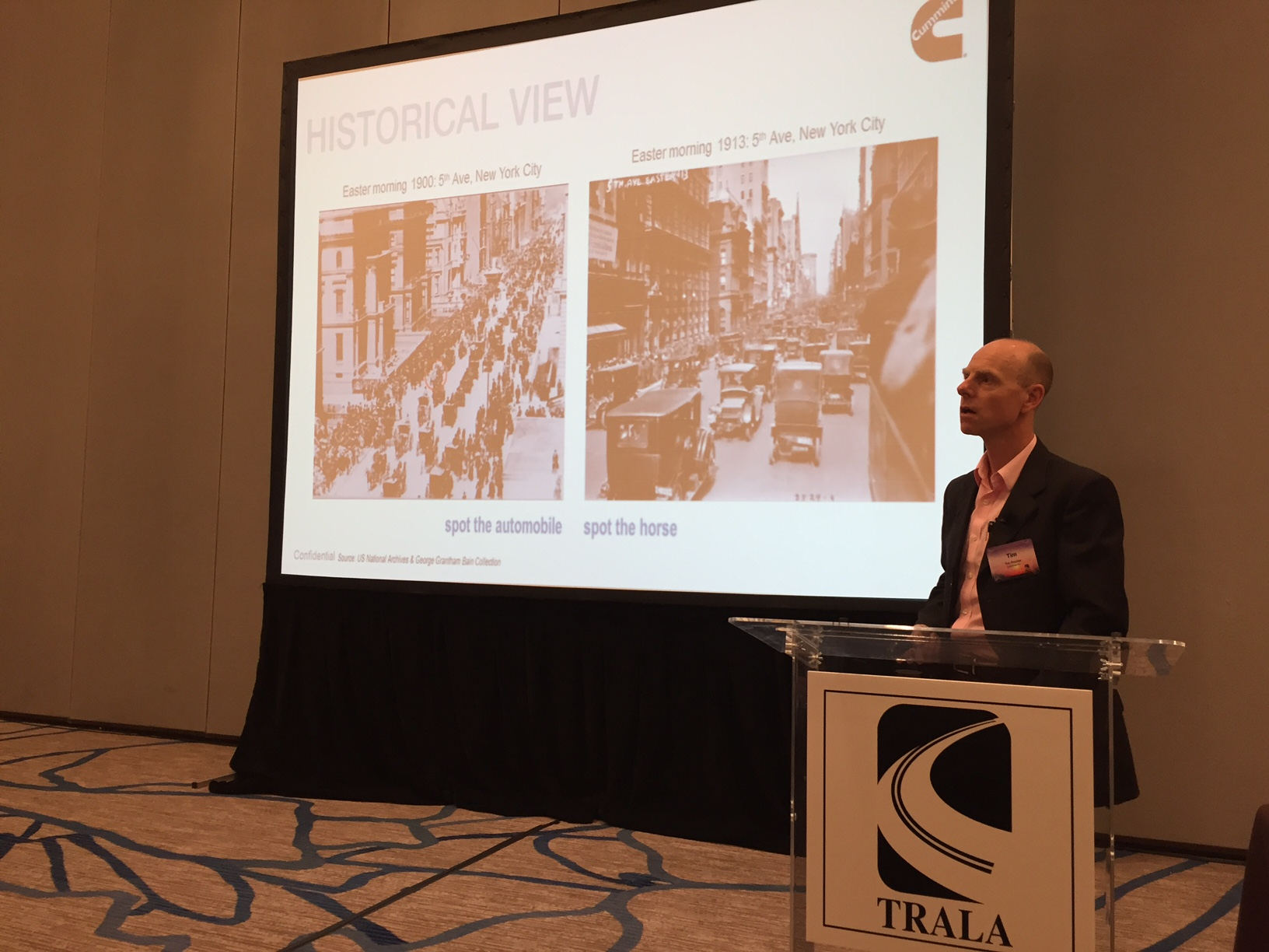 Tim Proctor shows two NYC snapshots side by side to illustrate how fast automobiles replaced horses as the major means of transportation at the start fo the 20th century Photo by Sean Kilcarr for Fleet Owner