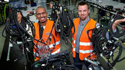 Volvo Truck employees holding cables Volvo Truck employees holding cables