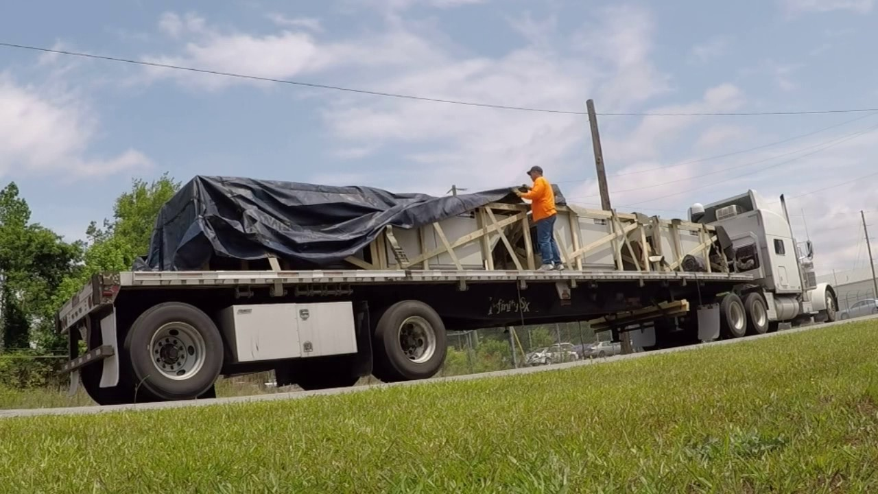 Truck driver tarping