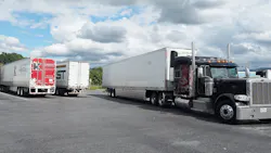 Semi-trucks and trailers at truck stop Semi-trucks and trailers at truck stop