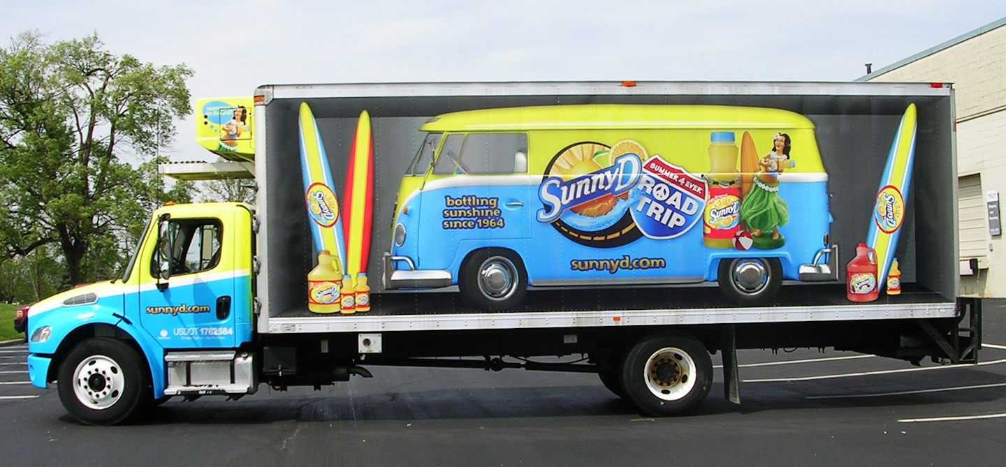 Van in a trailer? Check. Surfboards? Check. Road trip ready? You bet. Advertising Vehicles recognizes the effect trailers can have as mobile billboards.
