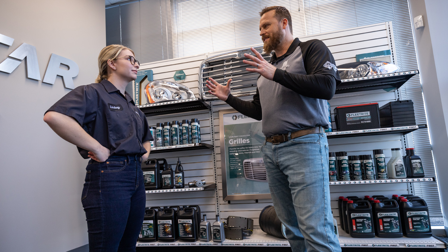 Fleetrite employees chat at a parts store location.