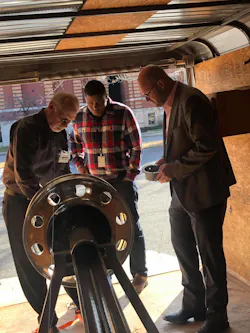 Bill Turner (left) demonstrates how the TetherTech device attaches to the wheel end. The system prevents wheel-off events even in the absence of traditional hub fasteners. Bill Turner (left) demonstrates how the TetherTech device attaches to the wheel end. The system prevents wheel-off events even in the absence of traditional hub fasteners.
