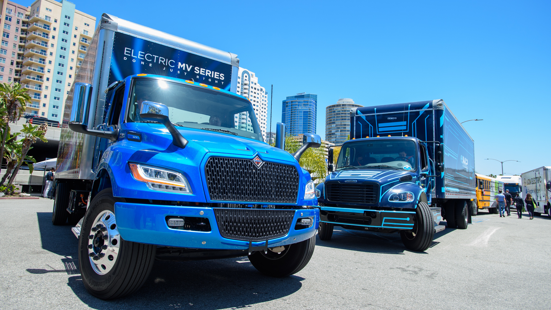 International&rsquo;s eMV, left, and Freightliner&rsquo;s eM2, battery-electric medium-duty trucks on display at ACT Expo 2022 in Long Beach, California.