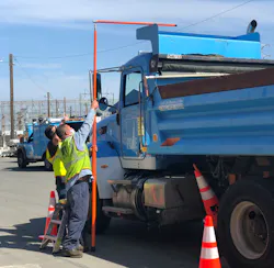 PG&E workers review vehicle heights during a safety summit at the fleet's Antioch facility. PG&E workers review vehicle heights during a safety summit at the fleet's Antioch facility.