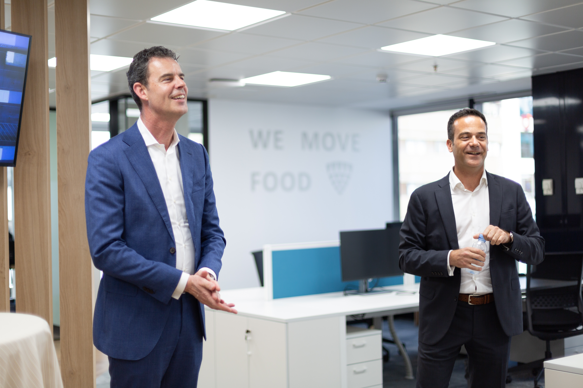 Harld Peters, Lineage Logistics president in Europe, at left, and Ra&uacute;l Fores Valles, regional vice president of Southern Europe, deliver remarks at the opening of the company's new headquarters in Madrid.