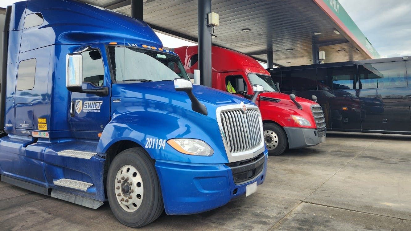 66960ebe2382e31e95422fea Johnsons Corner With Trucks