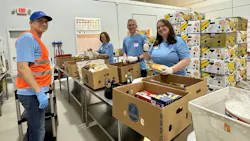 Edward Dryden, Carrier Refrigeration president, at center, and members of his leadership team volunteer by sorting and packing food at a local food bank. Edward Dryden, Carrier Refrigeration president, at center, and members of his leadership team volunteer by sorting and packing food at a local food bank.