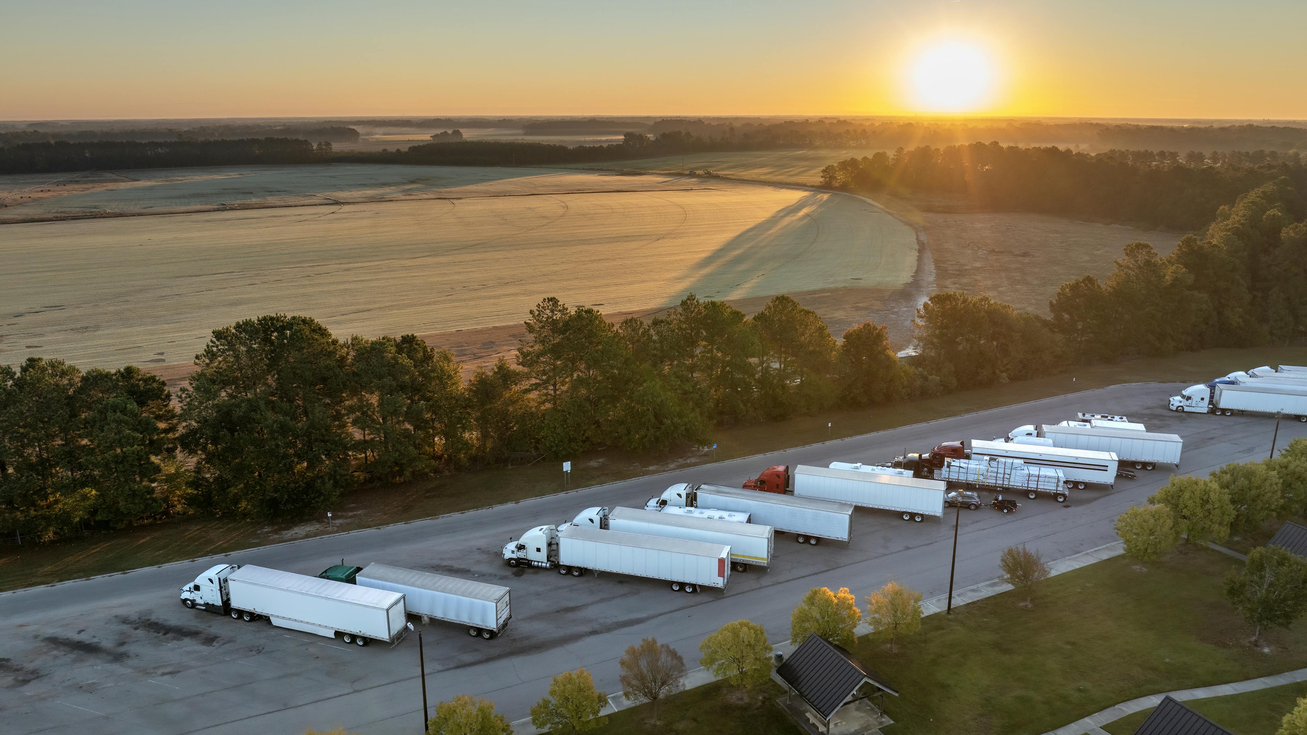 trucks parked at rest area near highway