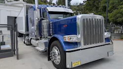 A Peterbilt 389 tractor-trailer with student driver tags unloads at the Greek Theatre in Los Angeles. A Peterbilt 389 tractor-trailer with student driver tags unloads at the Greek Theatre in Los Angeles.