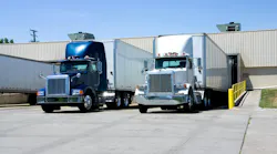 Semi-trailer trucks loading and unloading at a warehouse dock, illustrating freight shipping, logistics, and fleet operations Semi-trailer trucks loading and unloading at a warehouse dock, illustrating freight shipping, logistics, and fleet operations