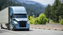 A blue Bonnet semi-truck with a black grille transports cargo in a refrigerated trailer along a highway, illustrating temperature-controlled freight logistics. A blue Bonnet semi-truck with a black grille transports cargo in a refrigerated trailer along a highway, illustrating temperature-controlled freight logistics.