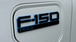 Logo for the Ford Lightning Pro on a white vehicle. Logo for the Ford Lightning Pro on a white vehicle.