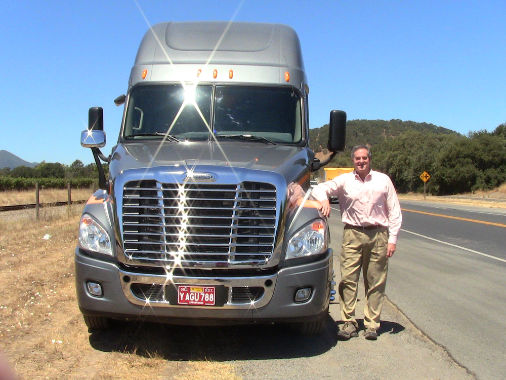Fleet Maintenance editor David A. Kolman alongside a 2014 Freightliner Cascadia Revolution