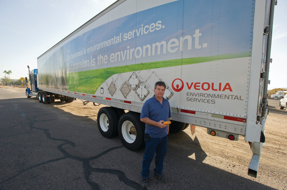 Electronics Recycling Division's fleet manager Michael Bomgardner holds the Zonar 2010 inspection tool which his drivers use as an electronic vehicle inspection reporting solution for pre- and post-trip inspections.
