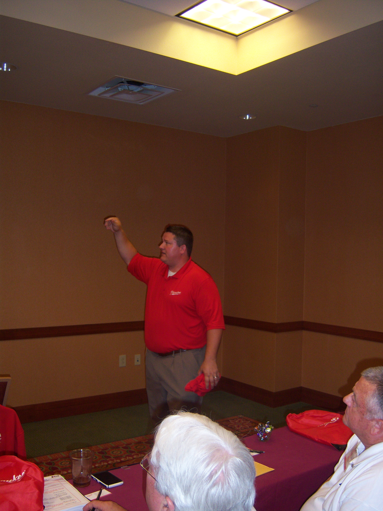 Daniel Jonke explains new cordless power technology during the Ace Tool Co. national dealer expo.